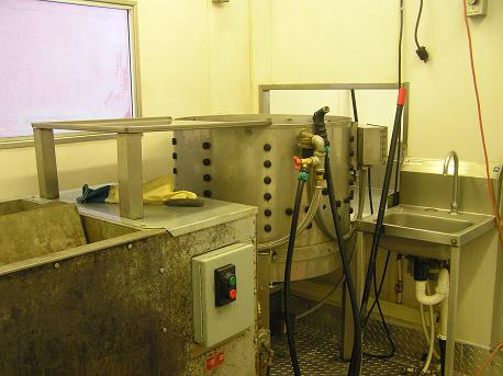 Image:Scalder plucker hand sink wall separating kill area small.JPG